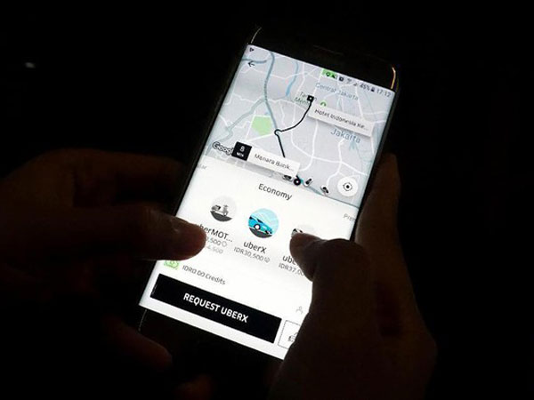 Dampak Grab Akuisisi Uber pada Penumpang, Mitra Pengemudi Hingga Tarif